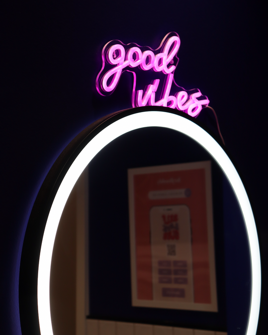 Picture from HejBuddy studio, with neon sign saying good vibes