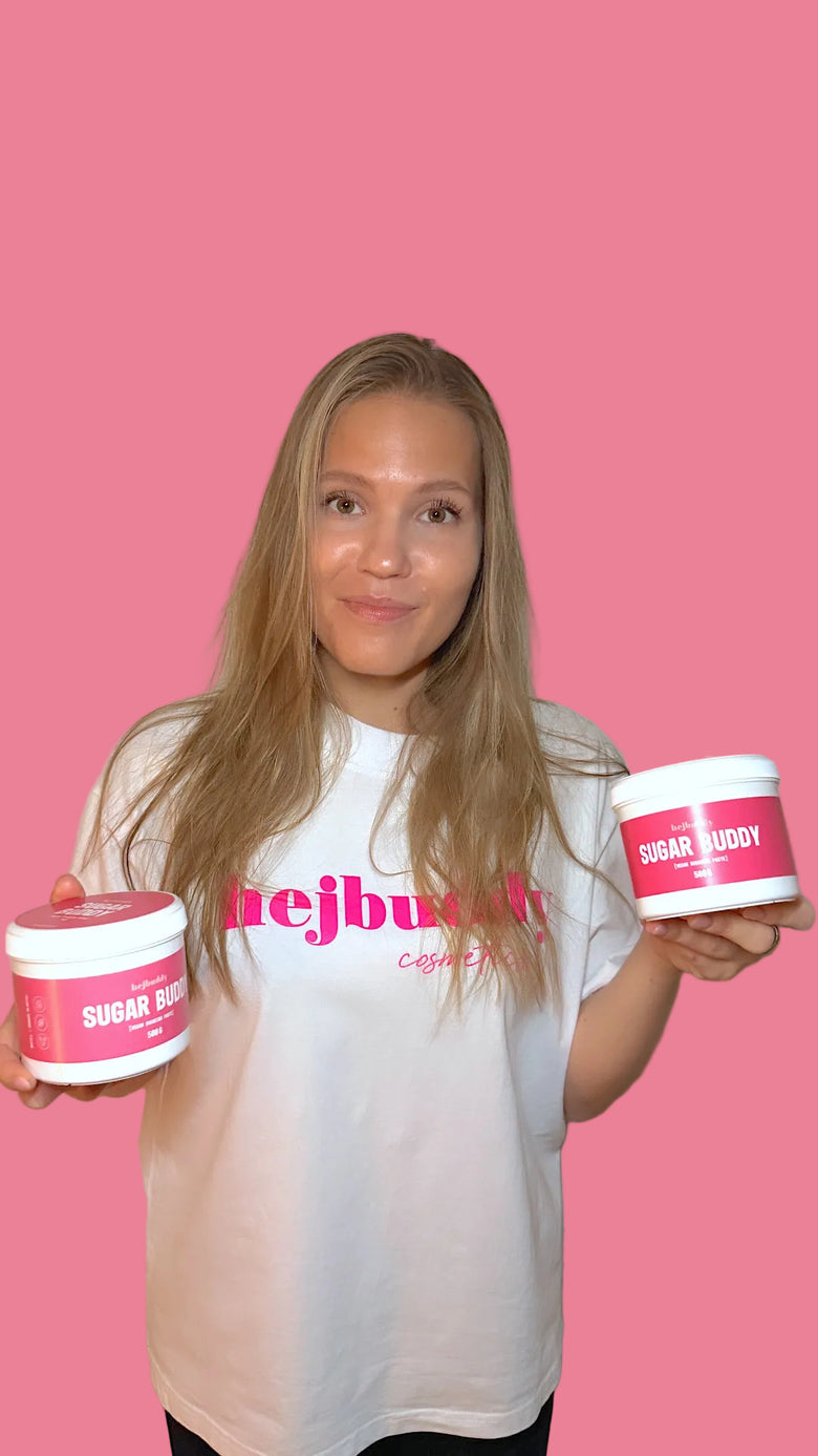 Woman keeping two HejBuddy-brand Sugar Buddy jars on hands