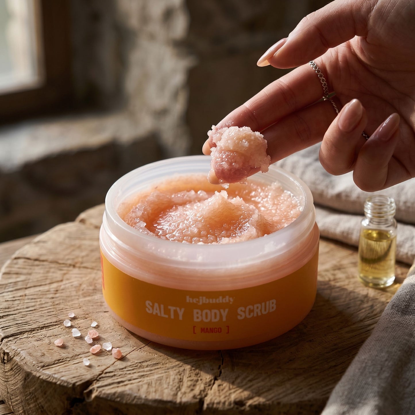 Close-up of Mango Salty Body Scrub showing its glossy, frosty texture with natural side lighting emphasizing the nourishing qualities.